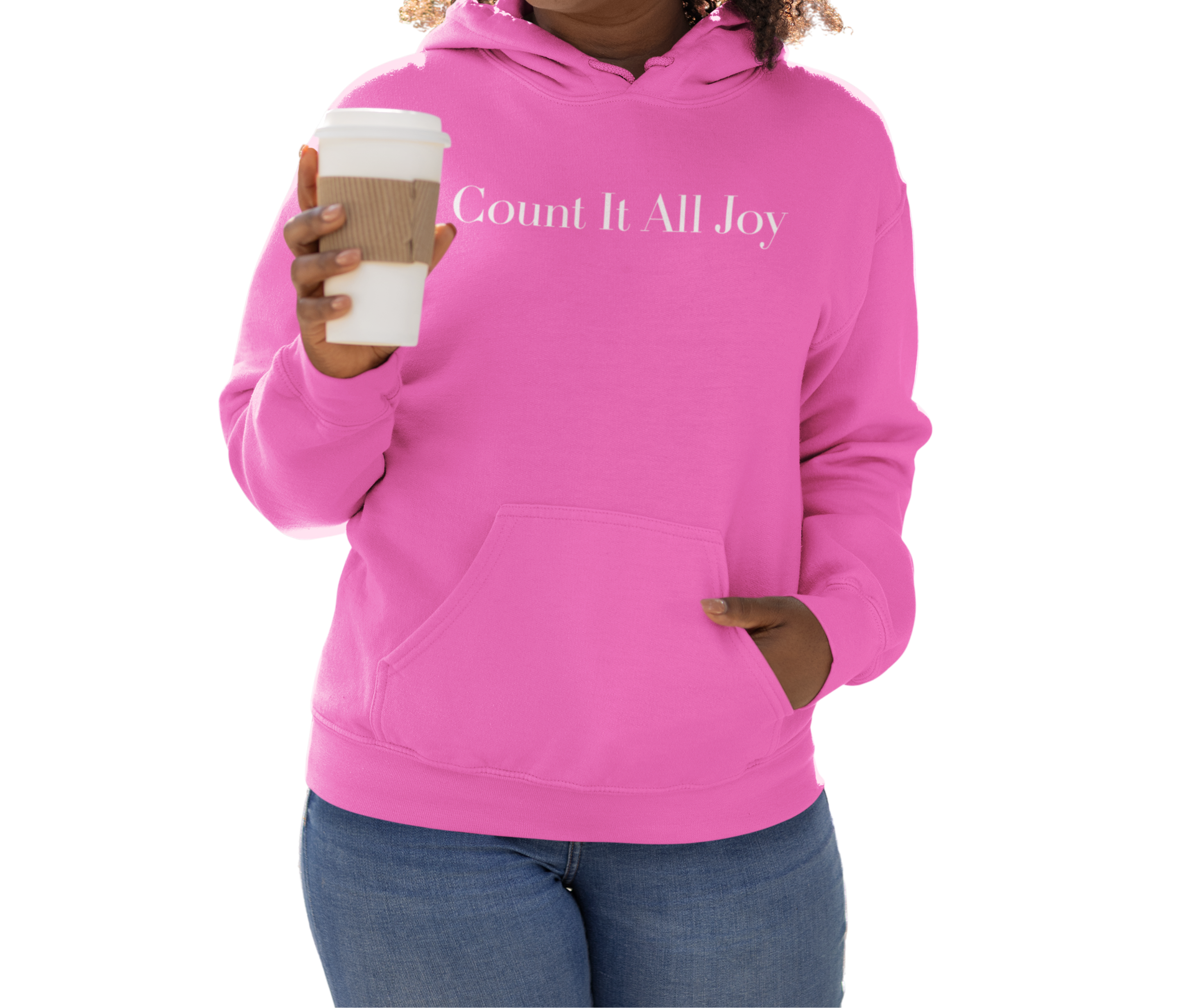 Person wearing a pink hoodie with 'Count It All Joy' text, holding a coffee cup.